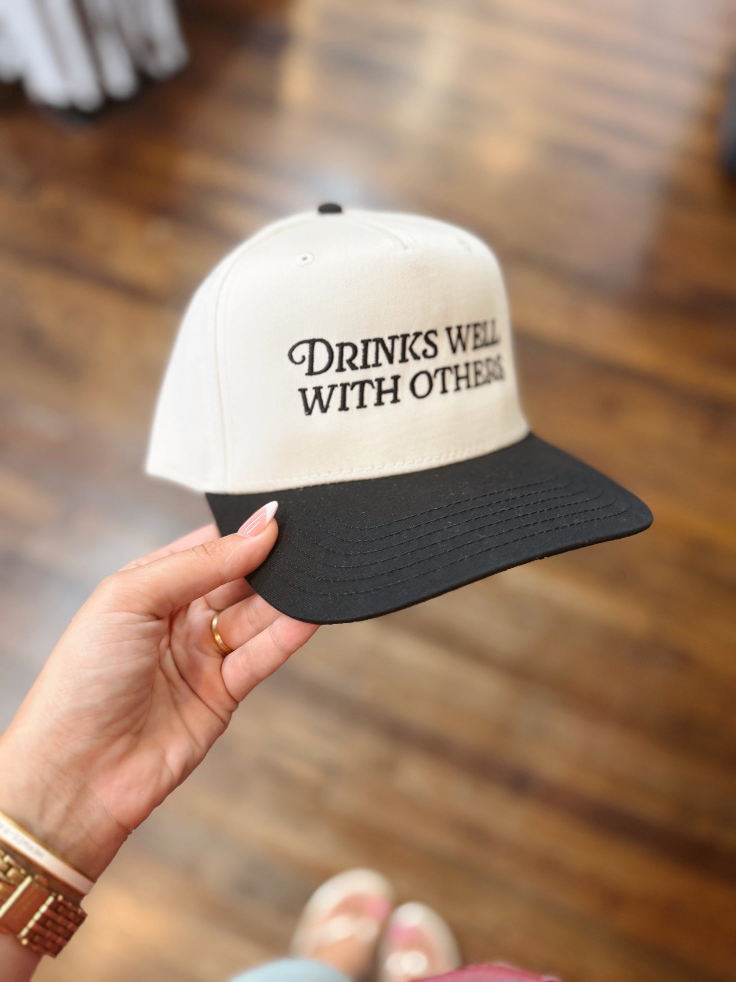 Drinks Well With Others Trucker Hat