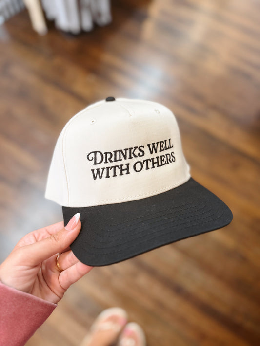 Drinks Well With Others Trucker Hat
